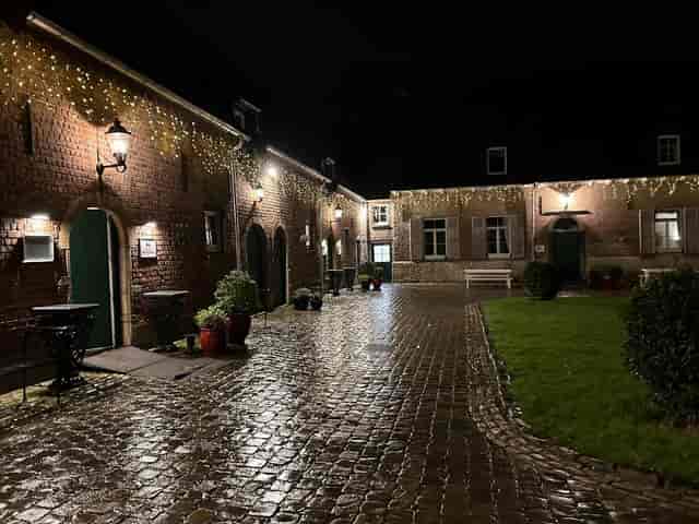 Great Barn venue with historic brick architecture for intimate wedding or corporate evening events.