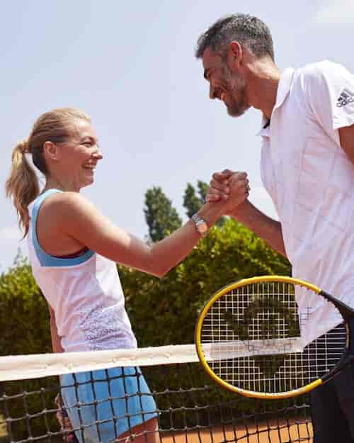 Corporate team-building at Aspria Royal La Rasante tennis courts, promoting professional networking.