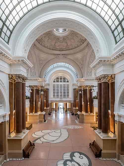 Neoclassical Prestige Room foyer for luxury gala arrival and premium networking reception.