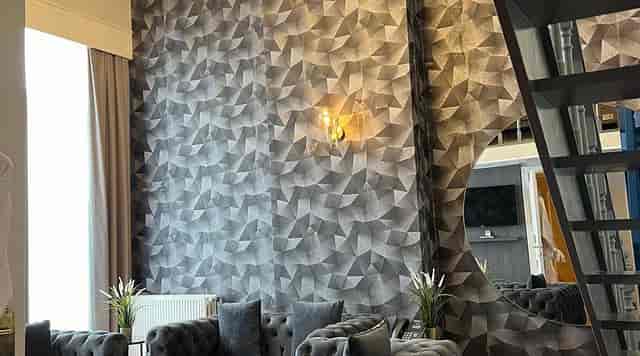 Premium executive breakout room with textured accent wall for VIP lounge or networking events.