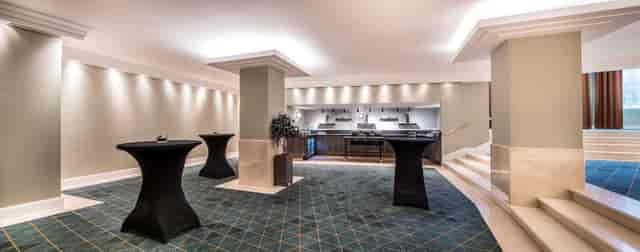 Elegant banquet hall in Hilton Brussels, perfect for networking events and receptions.