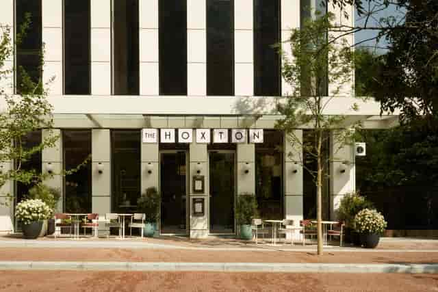 Modern hotel entrance at The Hoxton Brussels, perfect for upscale social events.