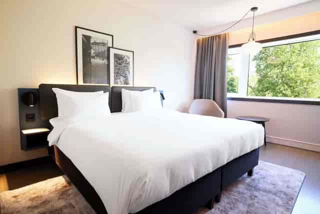 Modern hotel meeting room with task lighting for business events and corporate conferences.