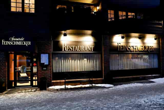 Elegant Feinschmecker restaurant featuring warm lighting for private dinners and corporate events.