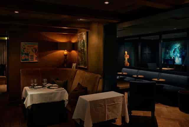 Feinschmecker private dining room with plush banquette seating for exclusive events and networking.