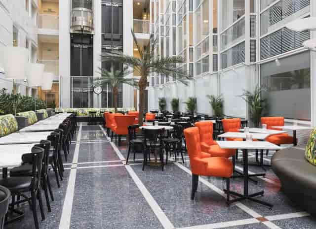 Thon Hotel Cecil atrium with café seating, perfect for networking events and corporate breakouts.