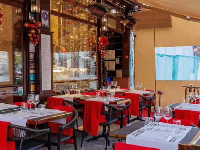 The Iris restaurant patio with festive holiday lighting for corporate events and private buyouts.