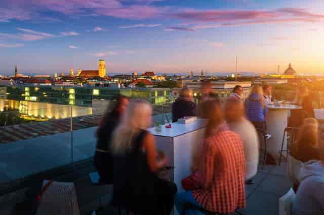 Rooftop networking reception at DECK21 with premium cityscape views for evening corporate events.