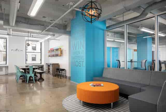 Contemporary roof deck lounge for corporate team huddles and professional networking events.