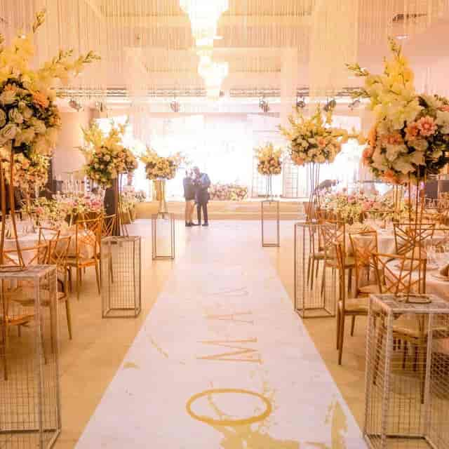Wedding reception in The Civic Centre with floral centerpieces and aisle runner for event venues.