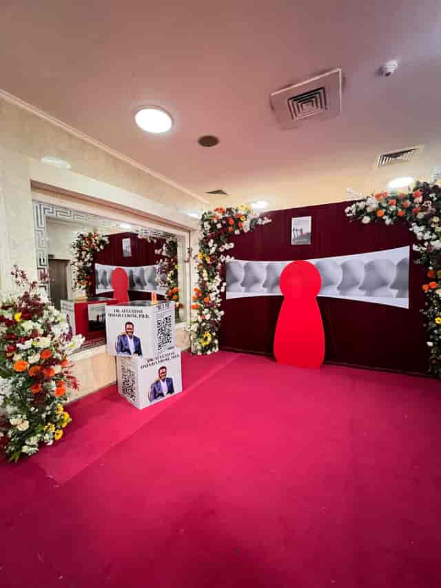 Branded banquet hall event with step-and-repeat backdrop for corporate conference and gala.