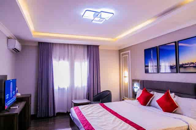 Modern Super Deluxe hotel room with workspace, ideal for business travel and corporate stays.