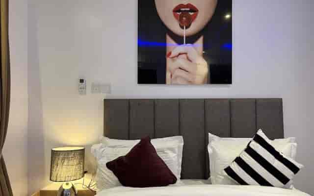 Modern hotel guest room at The Muse by LVG featuring bold artwork for leisure travel stays.