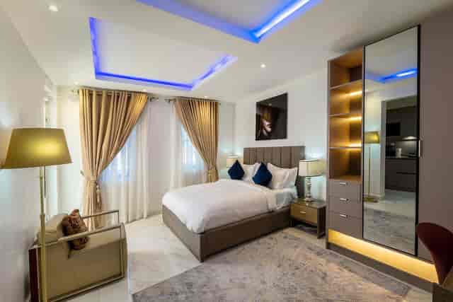Luxury hotel room at The Muse by LVG with ambient lighting for VIP executive lodging.