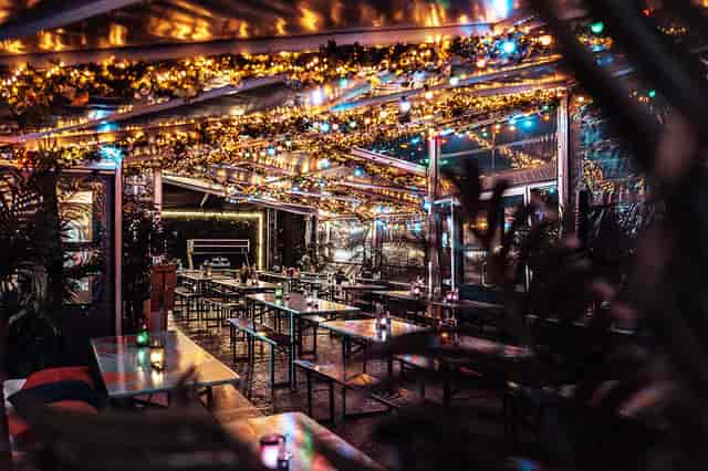 Festoon-lit Upper Deck venue at MS Bjørvika for holiday mixer and networking events.