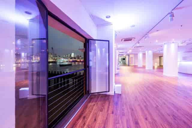 Modern event space with large windows, ideal for receptions and gala dinners.