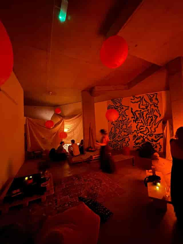 Creative event space with warm lighting, ideal for intimate gatherings and workshops.