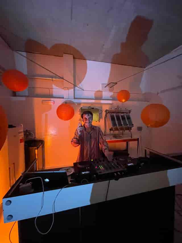 DJ setup with warm lanterns for vibrant social gatherings at 411 Bars venue.