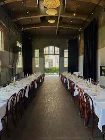 Smedjen Pakhus 11: Industrial chic long-table venue for corporate events and dinners.