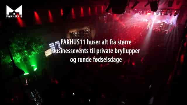 Smedjen at Pakhus 11: Industrial event space with atmospheric lighting for corporate conferences.