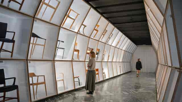 Designmuseum Danmark banquet hall with backlit modular shelving for corporate event exhibitions.