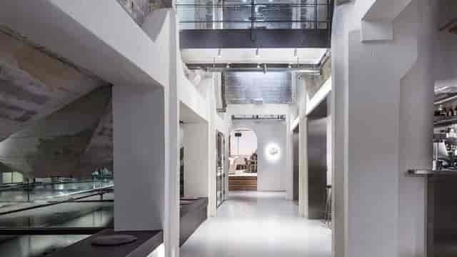 Industrial event space at Hotel Ottilia with multi-level architecture for corporate gatherings.