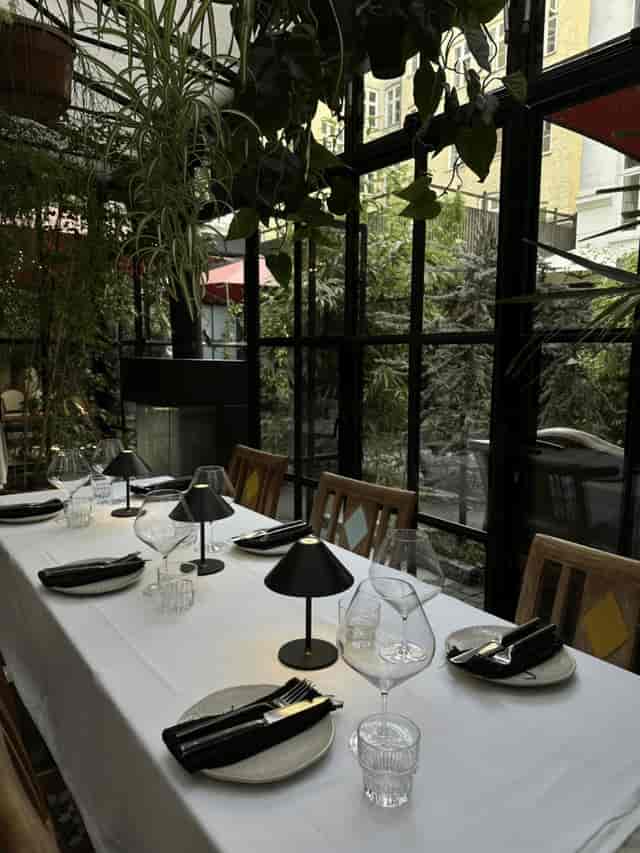 Organic restaurant at Babette Guldsmeden: greenhouse setting for corporate dinner or board retreat.