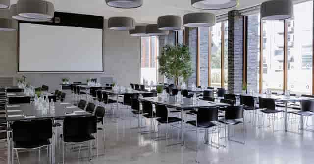 Modern Charlottehaven conference room with floor-to-ceiling windows for corporate workshops.