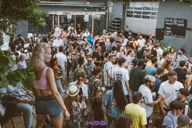 Industrial warehouse bar at KARGO CPH: underground event space with open-air crowd management.