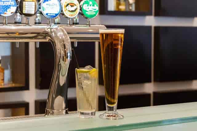 Draft bar at networking reception featuring diverse beer and cocktail options.