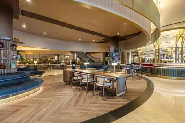 Modern hotel lobby breakout area for business networking and corporate events.
