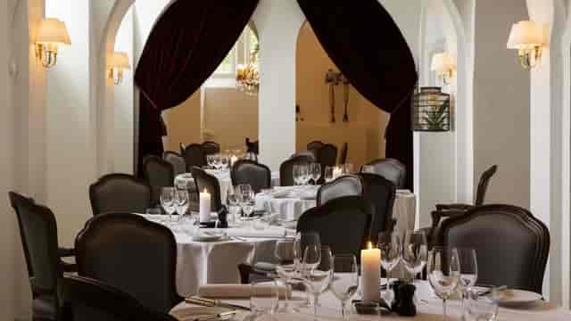 Elegant banquet hall with stone arches for private dining or VIP corporate events in Copenhagen.