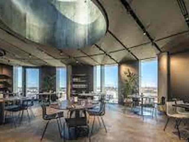 Modern industrial cocktail bar for corporate events and networking dinners.