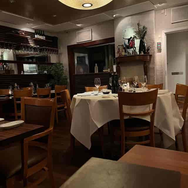 Private dining room with linen-draped tables for board dinners and VIP events.