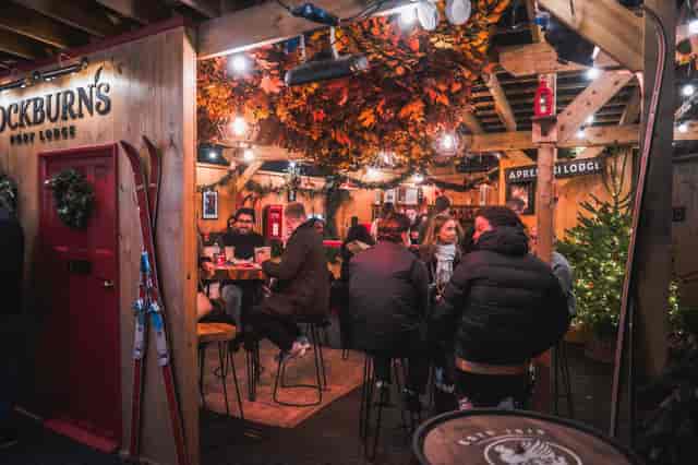 Cozy après-ski venue with rustic decor for winter events and holiday parties.