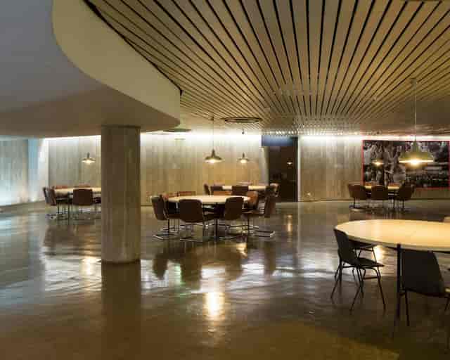 Industrial-chic Espace Niemeyer breakout space for collaborative workshops and networking events.