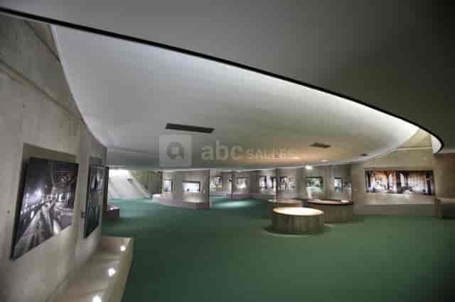 Modern Grand Hall at Espace Niemeyer, featuring circular displays for cocktail events and exhibits.