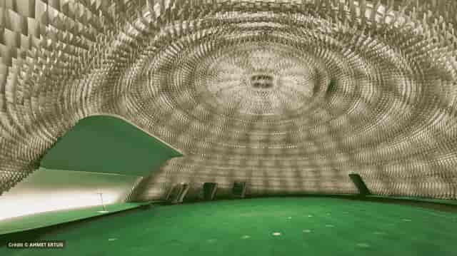 Odyssée Espace Niemeyer: Circular plenary room with dramatic acoustic ceiling for corporate events.