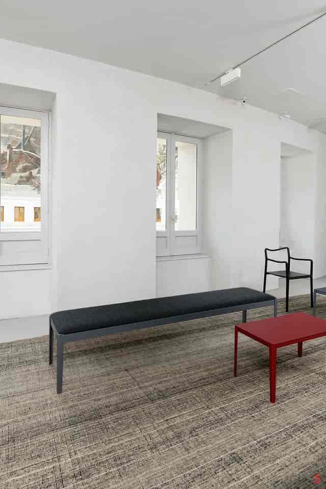 Minimalist lounge at Bourse de Commerce for corporate networking or intimate event space.