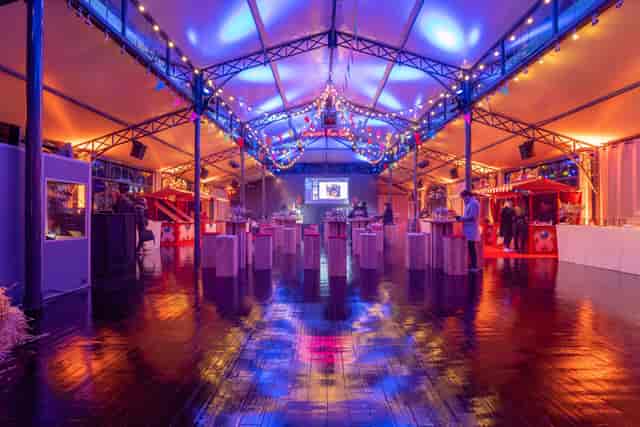 Orangerie d'Auteuil marquee with cocktail furniture for networking event and reception.