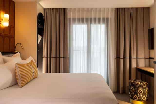 Upscale hotel room for executive retreats and incentive travel with a curated workstation.