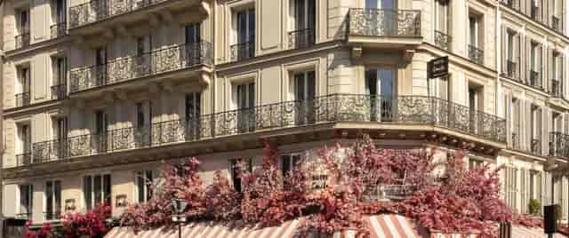 Haussmann-style Hôtel Émile exterior for boutique weddings and corporate brand activation events.