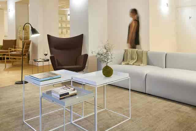 Modern breakout area with soft seating for professional networking events and business meetings.