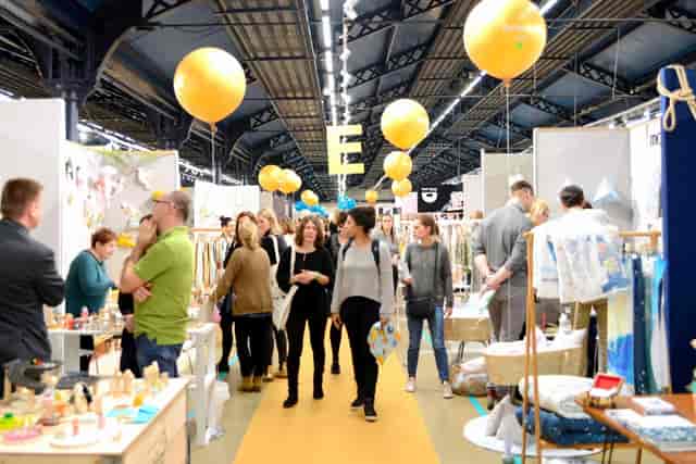 Trade show meeting space at Parc des Expositions with balloon aisle decor for event planning.