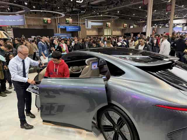 Trade show booth with vehicle focal point at Parc des Expositions for brand activation and events.