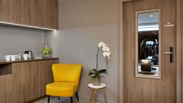 Auteuil Tour Eiffel hotel lounge with beverage station for corporate events and breakout sessions.