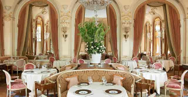 Ritz Paris banquet hall with elegant floral centerpiece for luxury social events and luncheons.