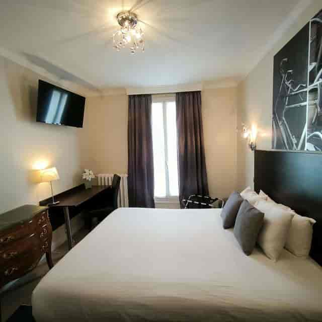 Boutique hotel suite with desk for solo business travel and event accommodation.