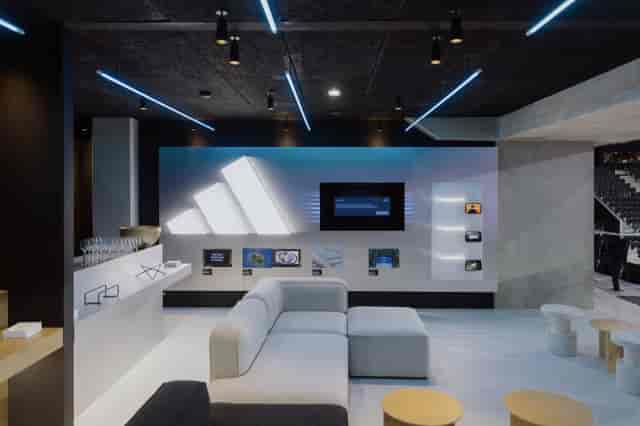 VIP corporate lounge at Adidas Arena with modular seating for premium networking and events.