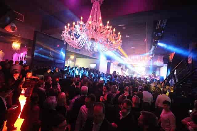 Upscale Salons Maillot nightclub with ornate chandelier for evening reception event photography.